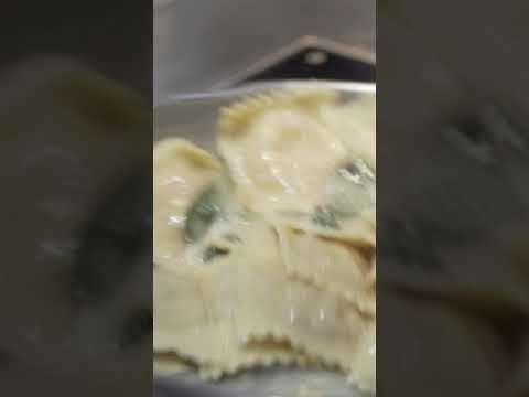 Video still of ravioli cooking in a pan